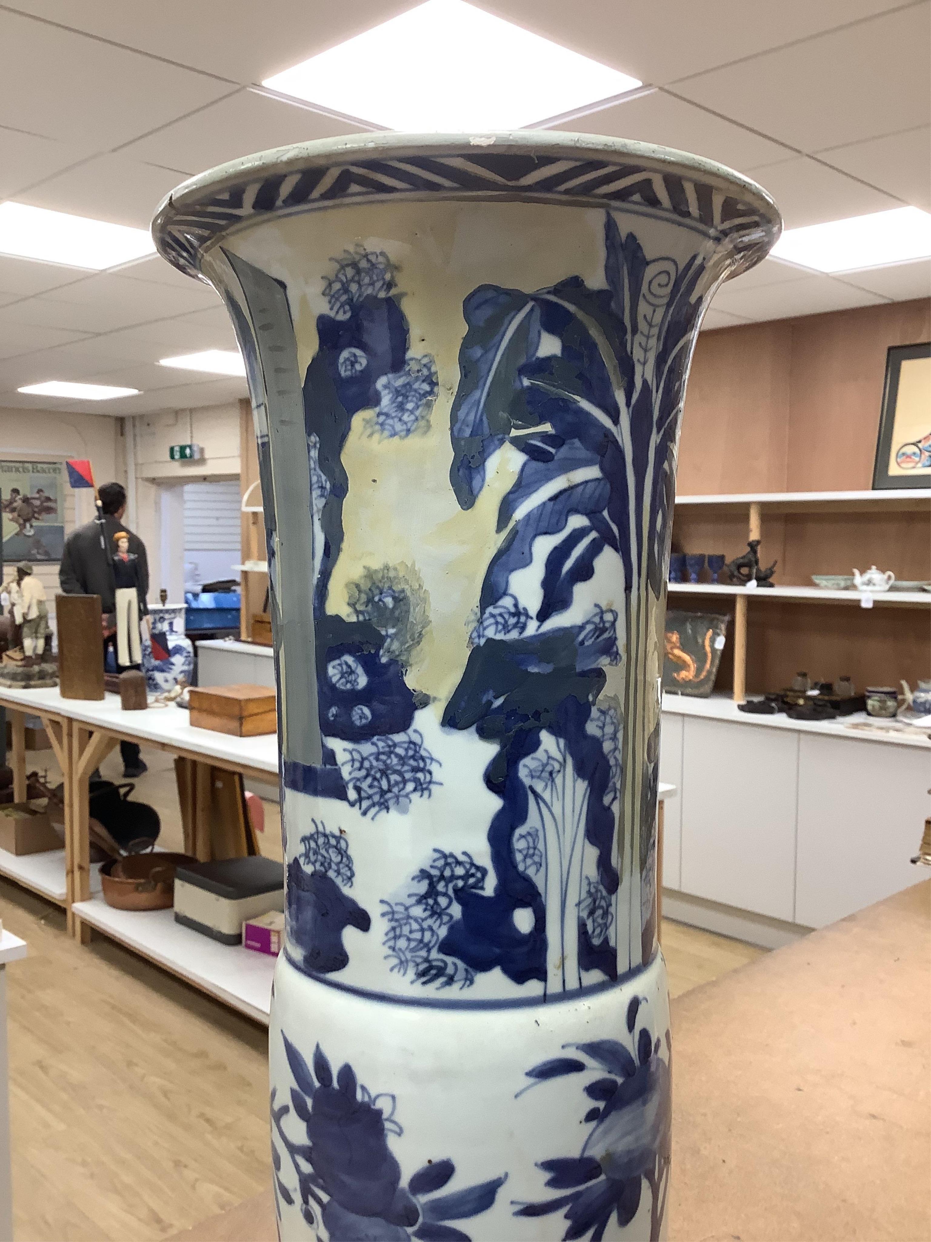 A Chinese blue and white sleeve vase. 53cm high. Condition - heavily restored.